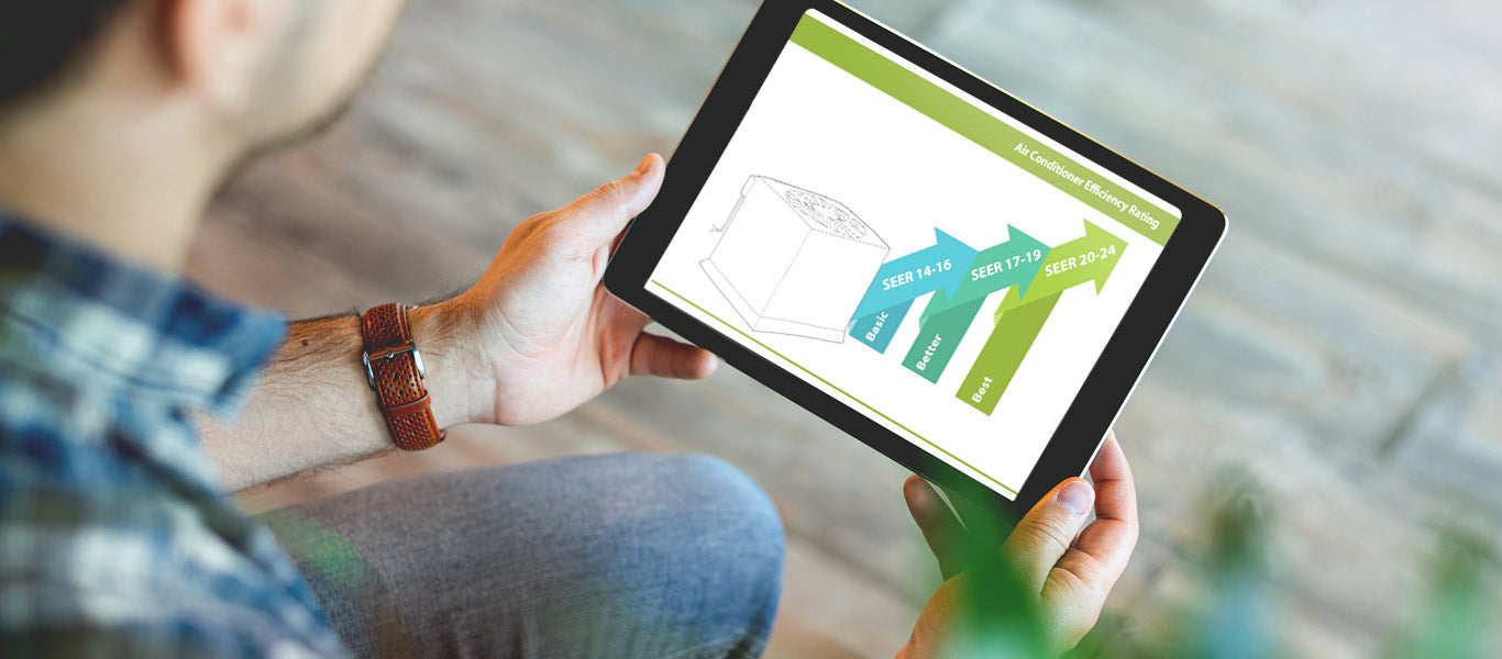 man holding tablet and looking at SEER rating graph