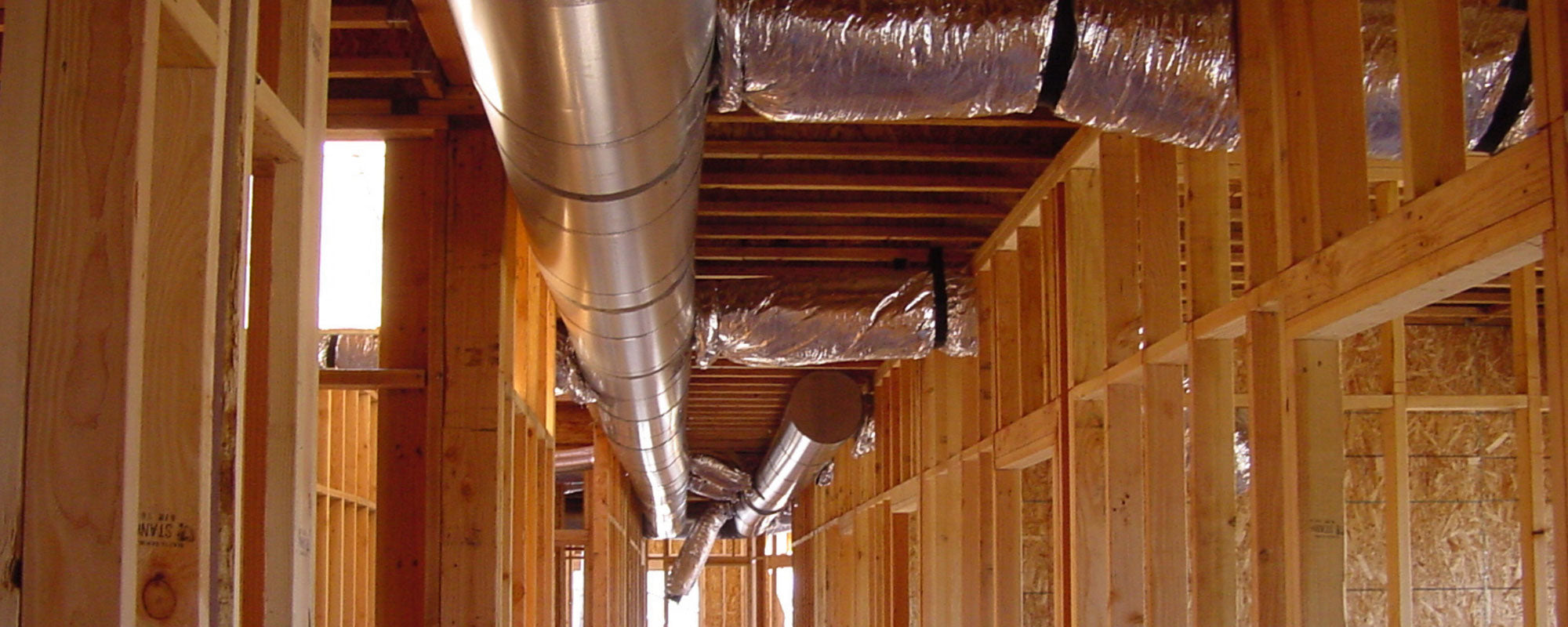 forced air heating ductwork installed in unfinished home