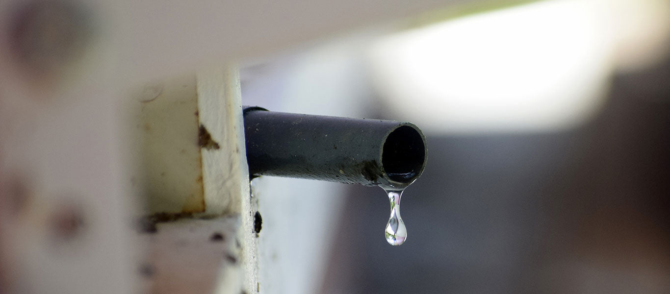 air conditioner leaking water outside from the condensation drain line