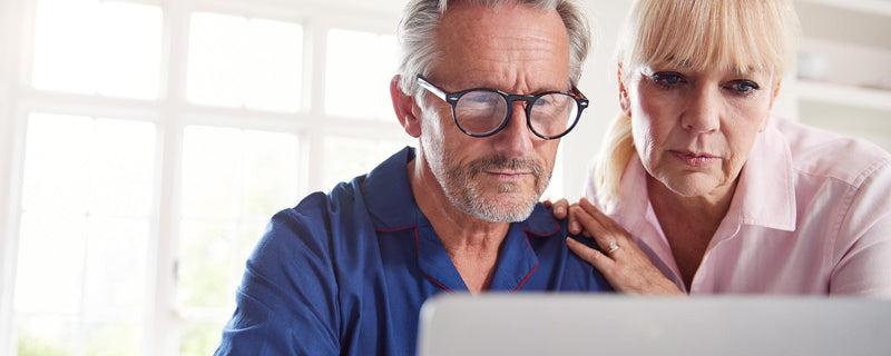 older couple researching online for what size furnace they need for their home
