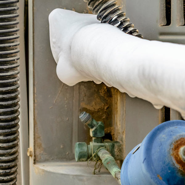 How can I fix an air conditioner's frozen pipe?