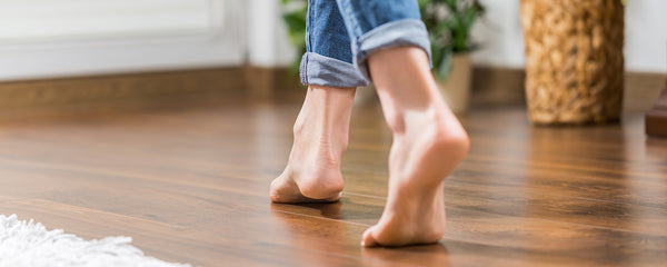 person walking barefoot on hydronic heating installed in home
